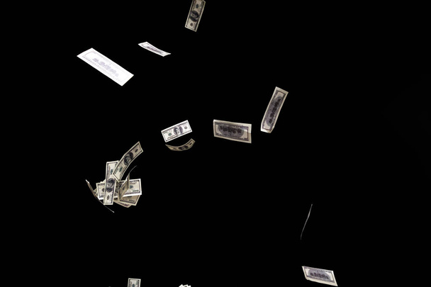 hundred dollars banknotes fly on black background. money rain concept - Photo, image