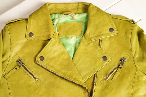 Green color leather jacket. Leather jacket macro details. - Zdjęcie, obraz