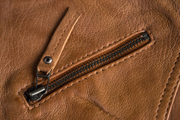 Light brown leather jacket zippers and pockets. Macro leather jacket details - Фото, зображення