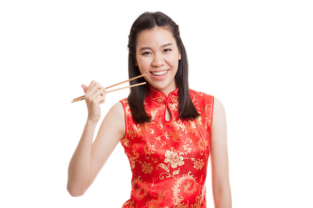 Asian girl in chinese cheongsam dress with  chopsticks. - Zdjęcie, obraz