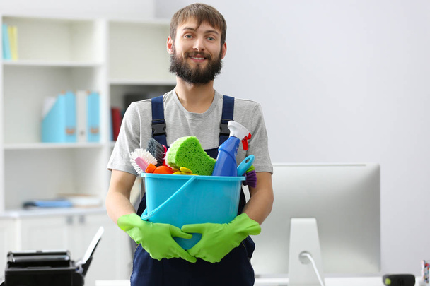 young man with cleaning supplies - Photo, Image