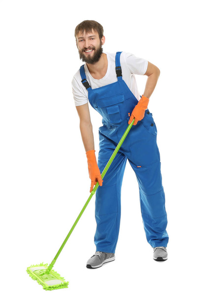 Young man moping floor - Foto, Imagen