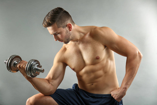 man doing exercises with dumbbell  - Photo, Image