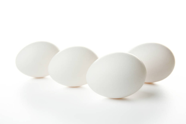 Raw eggs on white  - 写真・画像