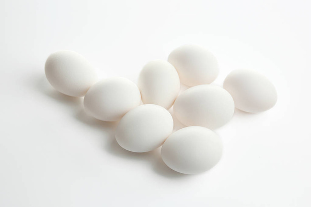 Raw eggs on white - Foto, Imagen