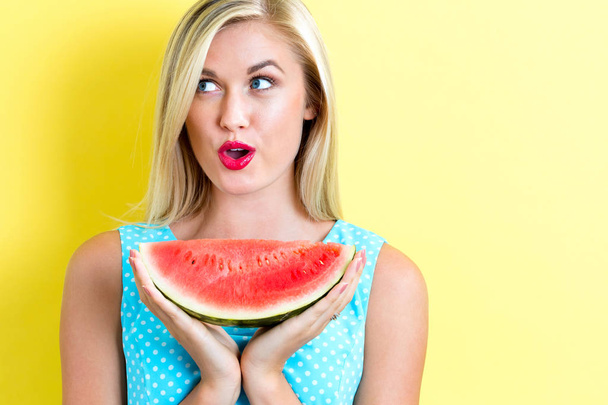Happy young woman holding watermelon - Zdjęcie, obraz