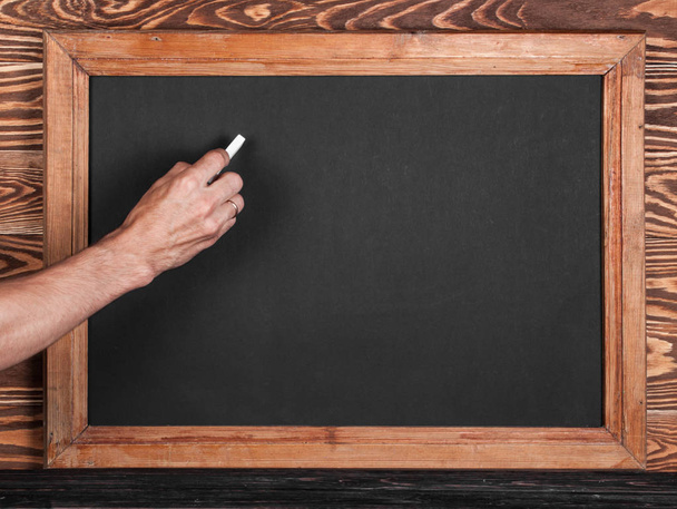 Piece of chalk and chalkboard - Photo, Image