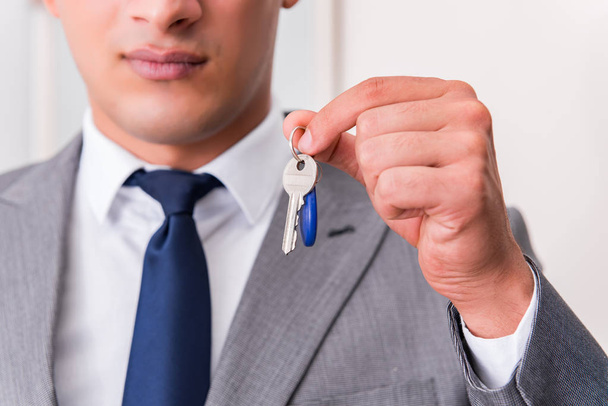 Businessman in real estate concept with home key - Photo, Image
