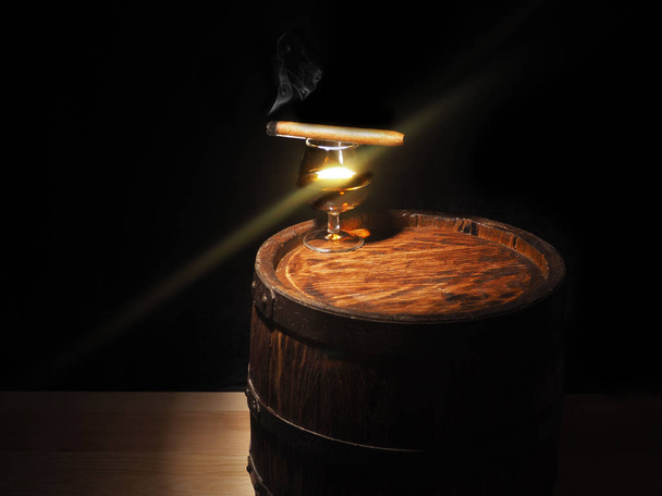 Cognac and Cigar on old oak barrel - Foto, Bild