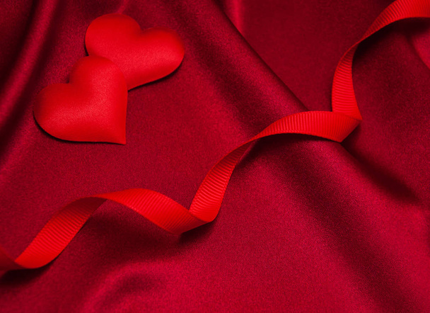 Red hearts and silk - Фото, изображение