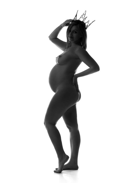Beautiful naked pregnant woman isolated on white background, pregnancy nude concept - Photo, image