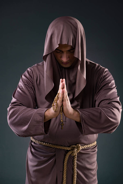 Monk in religious concept on gray background - Zdjęcie, obraz