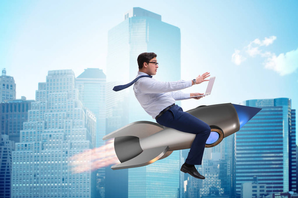 Businessman flying on rocket in business concept - Photo, Image