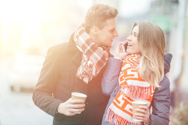 Young beautiful couple having fun in the winter on the street. Couple in love on Valentine's Day - Foto, imagen