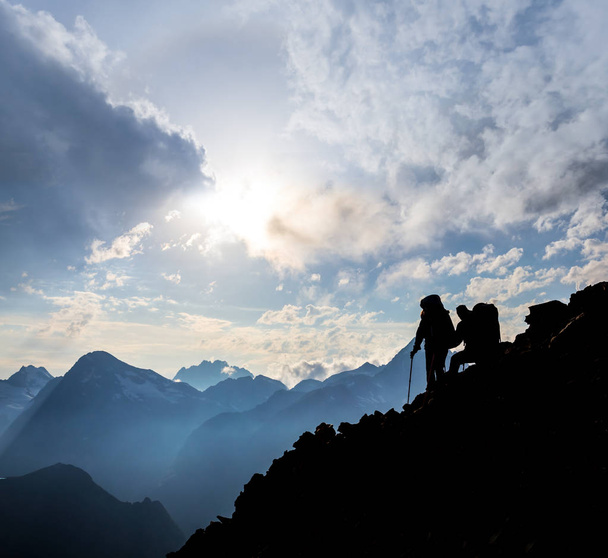 hikers on a mountain slope - Photo, image