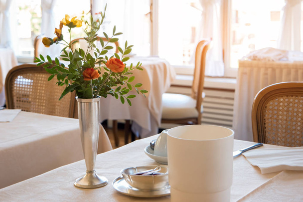 Flowers on dining table. - Photo, Image