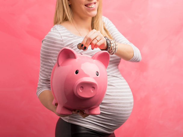 Pregnant woman saving money - Photo, Image
