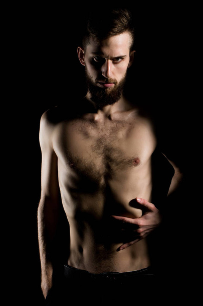 slim bearded man with thin bare torso isolated on black - Φωτογραφία, εικόνα