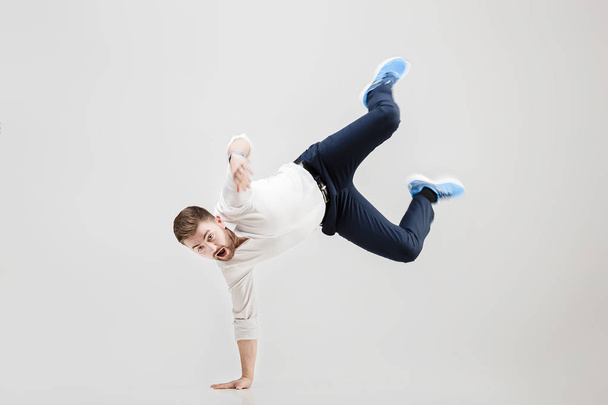 young happy businessman with beard in shirt break dancing on gre - Foto, Imagem