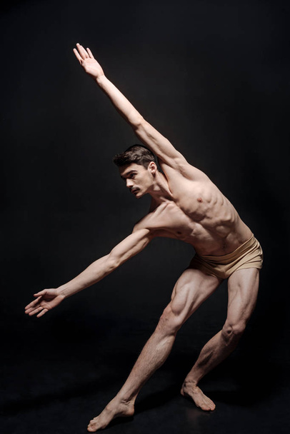 Flexible young dancer stretching  - Fotó, kép