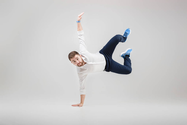 young happy businessman with beard in shirt break dancing on gre - Foto, Imagem