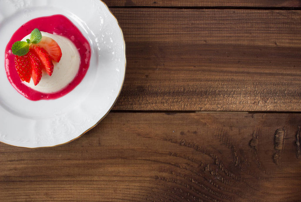 closeup italian dessert Pannacotta with strawberries - Фото, изображение