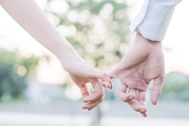 Close up of cute young newlyweds holding their hands  - Fotó, kép