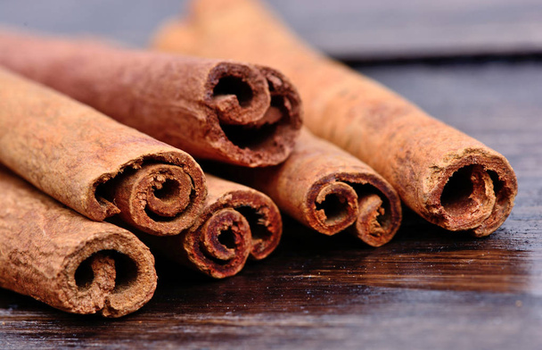 Group of cinnamon sticks on table - Photo, Image