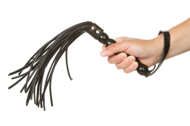 Strict Black Leather Flogging Whip in woman's hand - Photo, Image