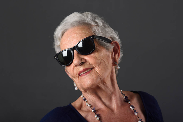 Portrait of a senior  woman with glasses - Photo, image