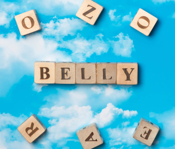 The word belly on the sky background - Zdjęcie, obraz