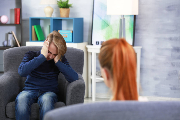 Depressed teenager having therapy session  - Photo, Image