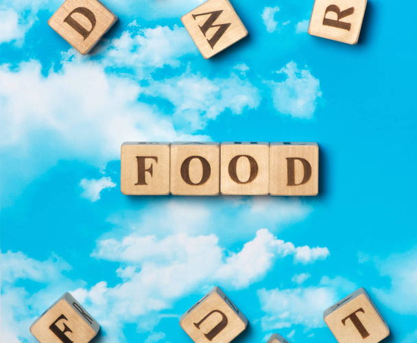 The word food on the sky background - Фото, изображение