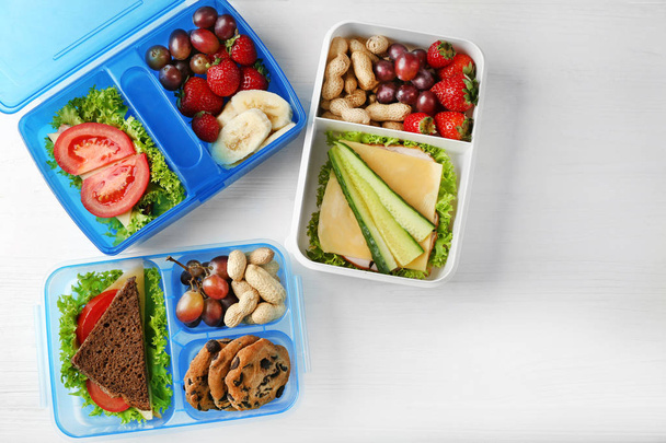 Lunchbox with sandwich and different products   - Photo, image