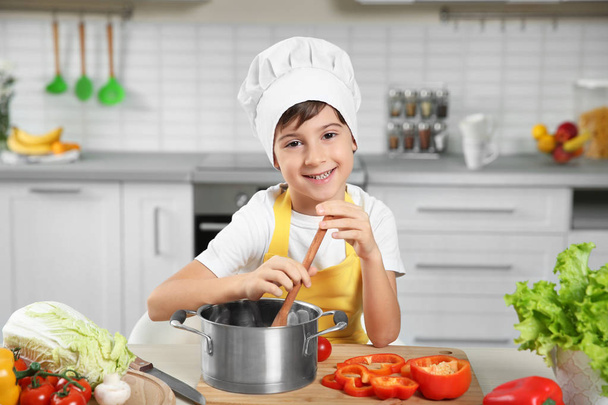 Cute boy cooking  - Foto, Bild