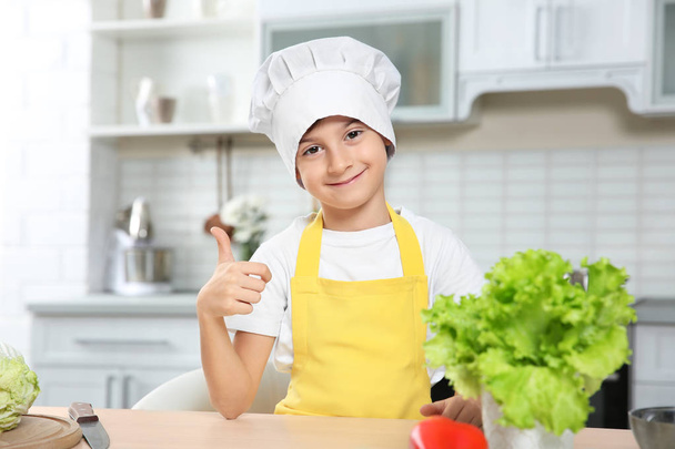 Cute boy cooking  - Foto, afbeelding