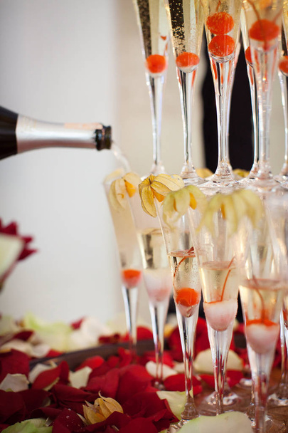 Pyramid of champagne glasses with cherry inside - Photo, Image