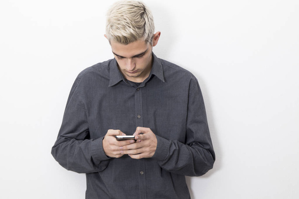 Young man with mobile phone - Foto, Bild