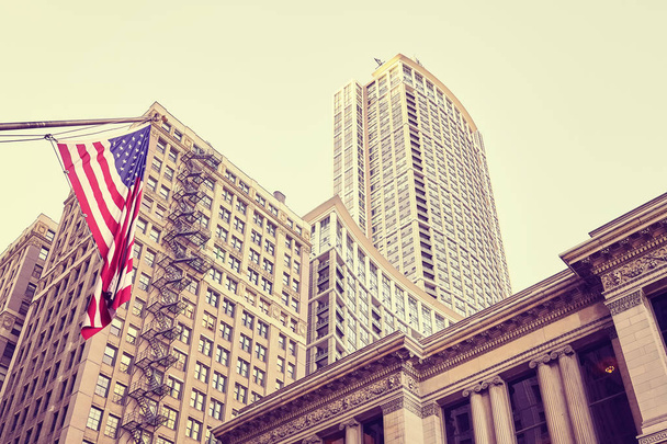 Color toned buildings and Flag of the United States in Chicago. - 写真・画像