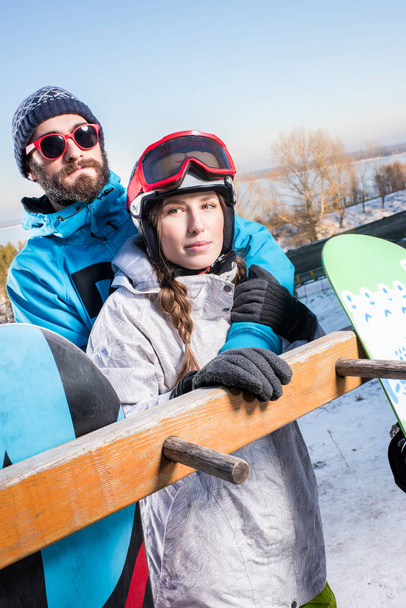 Couple of snowboarders embracing - Photo, Image