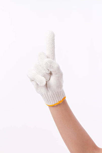 рабочая рука, указывающая вверх на один палец, в хлопковой перчатке
 - Фото, изображение