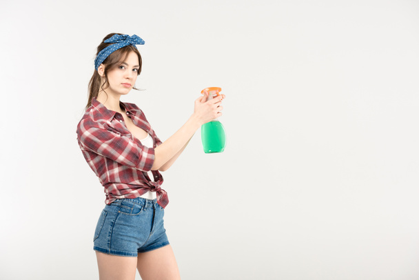 Young woman with spray bottle  - Фото, зображення