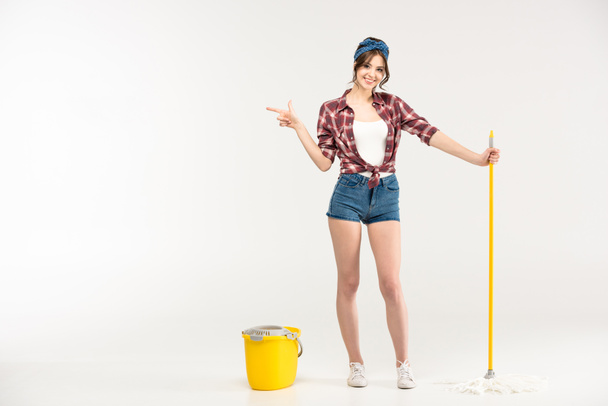 Young woman with mop - Foto, Bild