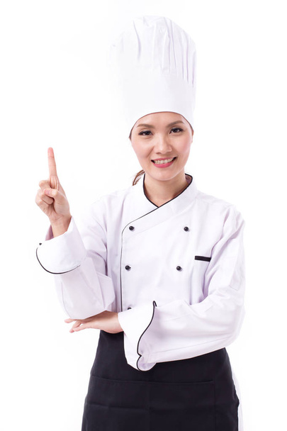 boldog, mosolygós, egy ujjal felfelé mutató pozitív női szakács - Fotó, kép