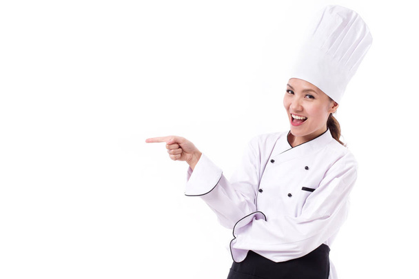 happy, smiling, positive female chef pointing sideway - Zdjęcie, obraz