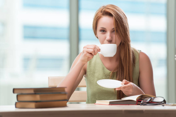 Young student preparing for exams drinking tea - Zdjęcie, obraz
