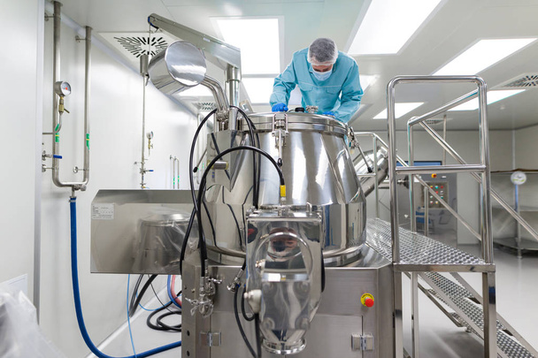 scientist look in steel tank in laboratory - Photo, Image