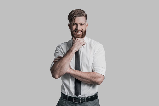 man with beard holding hand on chin - Valokuva, kuva