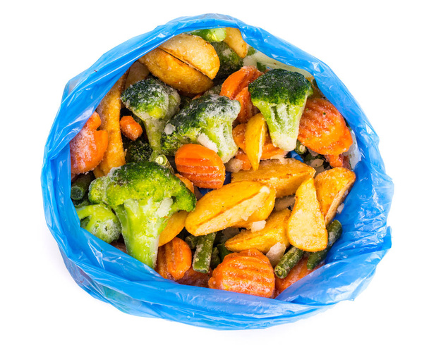 Verduras mixtas congeladas en una bolsa azul
 - Foto, Imagen