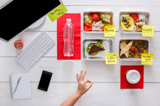 Healthy daily meals in office, top view at wood - Photo, Image